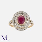 A Ruby and Diamond Cluster Ring 18K gold, set with an oval cut ruby to the centre of two