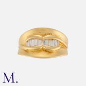 A Diamond Ring in 18 carat yellow gold, set with baguette cut diamonds. Marked 750 18K. Maker's mark