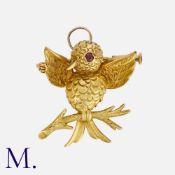 BOUCHERON. A Bird Pendant Brooch in 18K yellow gold, taking the form of a bird flapping whilst