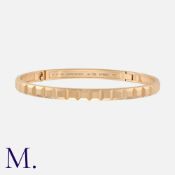 BOUCHERON, A Quatre Clou de Paris Bangle in 18 carat rose gold, the hinged body with repeated square