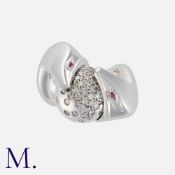 BOUCHERON, A Diamond and Ruby 'Trouble' Ring in 18 carat white gold, designed as two snakes around a