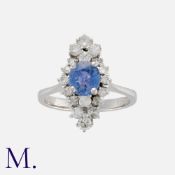An Unheated Sapphire and Diamond Ring in 18 carat white gold, set with a cushion cut sapphire of