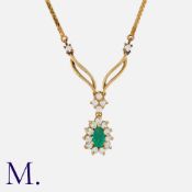An Emerald and Diamond Pendant Necklace in 18K yellow gold, set with a pear cut emerald to the