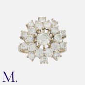 A Diamond Cluster Ring in white gold, set with a cluster of round cut diamonds totalling