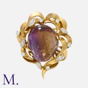 ALAN MARTIN GARD, An Ametrine and Diamond Brooch in 9 carat yellow gold, set with a large cabochon