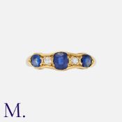 An Antique Sapphire and Diamond Ring in 18K yellow gold, set with an oval cut sapphire to the centre