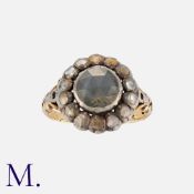 A Rose Cut Diamond Cluster Ring in yellow gold and silver, set with a central rose cut diamond