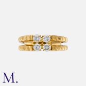 BOUCHERON. A Diamond Ring in 18K yellow gold, set with four round brilliant diamonds weighing 0.40ct