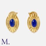 BOUCHERON. A Pair of "Jaipur" Earrings in 18K yellow gold with grooved design culminating in a lapis