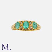 An Antique Emerald and Diamond Ring in 18K yellow gold, set with three oval cut emeralds with