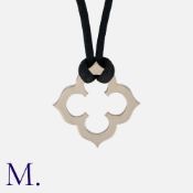CARTIER. A "Trèfle Gothique" Pendant and Cord in 18K white gold. Signed Cartier and serial