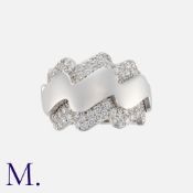 VAN CLEEF & ARPELS, A Diamond 'Wave' Ring in 18 carat white gold, designed as a stylised wave, set