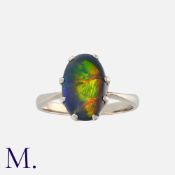 A Black Opal Ring in 18 carat white gold set with an oval shaped black opal of approximately 1.50