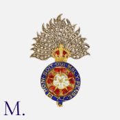 A Royal Fusileers Brooch in yellow gold and silver, with enamelled decoration and rose cut diamonds.