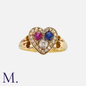 An Antique Ruby, Sapphire and Diamond Heart Ring in 18 carat yellow gold, the heart motif set with