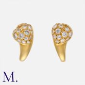 CARTIER. A Pair of Diamond Earrings in 18K yellow gold in a heart form, pavé set with round cut