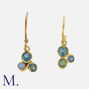 A Pair of Sapphire Earrings in 18 carat yellow gold, each set with a trio round cut sapphires of