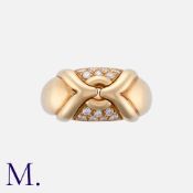 BULGARI, A Diamond Ring in 18K yellow gold, set with 14 round cut diamonds to a cross-over design.