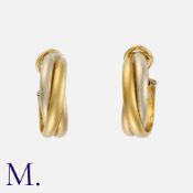 CARTIER. A Pair of Trinity Earrings in 18K yellow, white and rose gold. Signed Cartier and serial