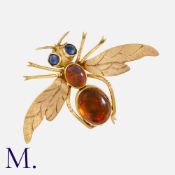 A Fire Opal Insect Brooch in yellow gold, set with two cabochon fire opals to the body and two