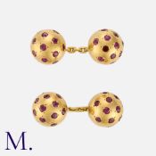 VAN CLEEF & ARPELS. A Pair of Ruby Cufflinks in 18K yellow gold and set with round cut rubies.