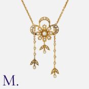 A Diamond and Pearl Pendant Necklace in 15 carat yellow gold, of floral form, set with an old cut