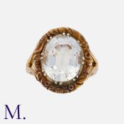 An Antique Blue Stone Ring in yellow gold, with a large oval blue stone in a cut down setting with