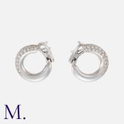 VAN CLEEF & ARPELS. A Pair of Diamond Hoop Earrings in 18K white gold, pavé set with diamonds (TDW