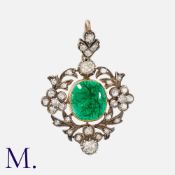 An Antique Emerald and Diamond Pendant in yellow gold and silver, set with a cabochon emerald (