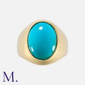 A Turquoise Ring in yellow gold, set with an oval cabochon turquoise. Unmarked; tests indicate