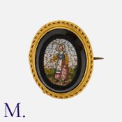A Micromosaic Brooch in yellow gold, set with a micromosaic depicting a lady in a rural scene.