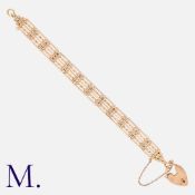 A Gold Gate Bracelet in 9K rose gold with 5-bar links (inner links ribbed), secured with a padlock