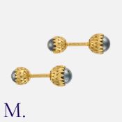 SCHLUMBERGER A Pair of 'Acorn' Cufflinks in 18 carat yellow gold, of stylised acorn form, set with