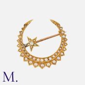 An Antique Diamond and Pearl Crescent Brooch in yellow gold, set with grey pearls and an old cut