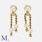 BOUCHERON. A Pair of Diamond and Pearl Earrings in 18K yellow gold, set with pearl and diamond