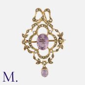 An Antique Amethyst and Pearl Pendant Brooch in 9K rose gold, with a large oval-cut amethyst