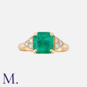 An Emerald and Diamond Ring in 18K yellow gold, set with an emerald cut emerald weighing approx. 1.