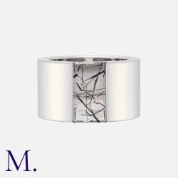 CARTIER. A Large Rutile Quartz Ring in 18K white gold, with a rutile quartz window in a wide band.