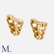 CARTIER. A Pair of Cufflinks in 18K yellow gold with woven pattern and gold bars. Signed Cartier and