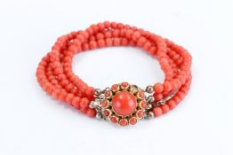 a four-strand blood coral bracelet, with yellow gold clasp, 14kt, Dutch hallmarked, (missing 1 blood
