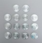 A collection of fourteen silver 10 Guilder coins, totaling 350 grams.