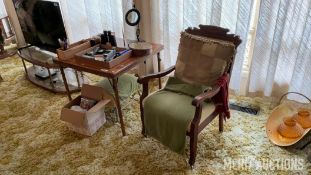 Table with Assorted Items and Chair