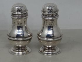 A pair of George V silver Casters of bulbous form, London 1930, 140gms