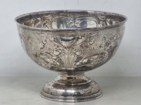 An Edward VII silver Rose Bowl of Art Nouveau design finely embossed sinuous lilies, etc,