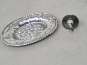 A modern silver embossed oval Trinket Dish, Birmingham 1987, and a Bottle Stopper, Birmingham 1965