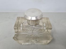 A George V silver lidded large glass Inkwell with pen rest, Birmingham 1923