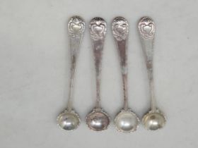 Four Georgian silver Salt Spoons with shell bowls, vacant cartouches, feather edges, one marked H. B