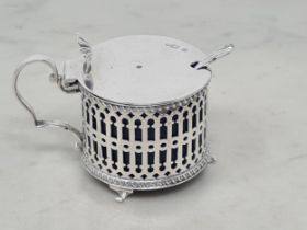An Edward VII silver pierced circular Mustard Pot, Birmingham 1902, and Spoon, 80gms