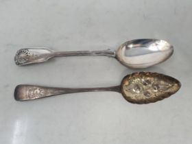 A George III silver Serving Spoon with fruit embossed bowl, engraved stem, London 1811, and a
