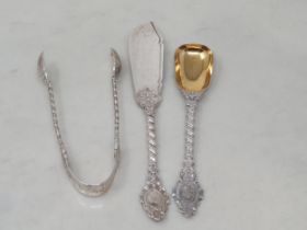A Victorian silver Sugar Tongs, Knife and Preserve Spoon with ornate spiral stems, London 1867/71,